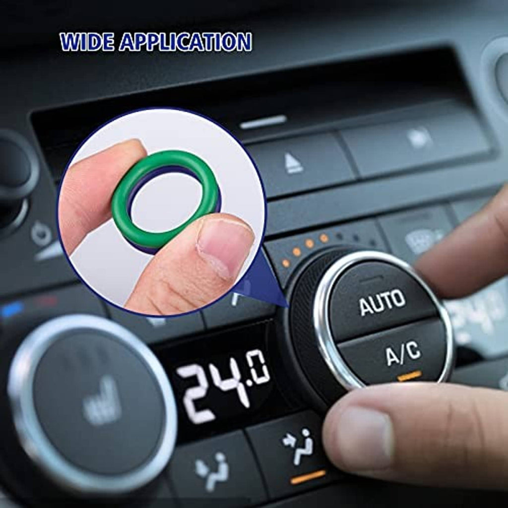 Green sealing O-ring for car A/C, close-up near dashboard control dial