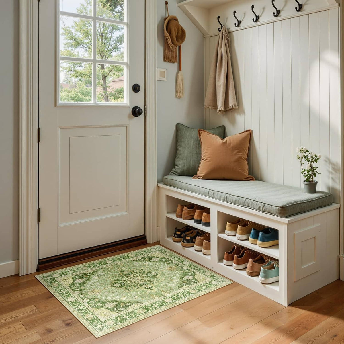 Washable area rug, rectangular green pattern placed on bedroom bench floor