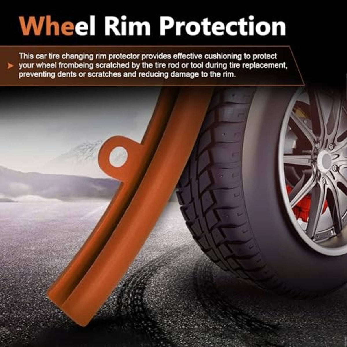 Orange wheel rim protection straps with yellow securing rope on a car wheel