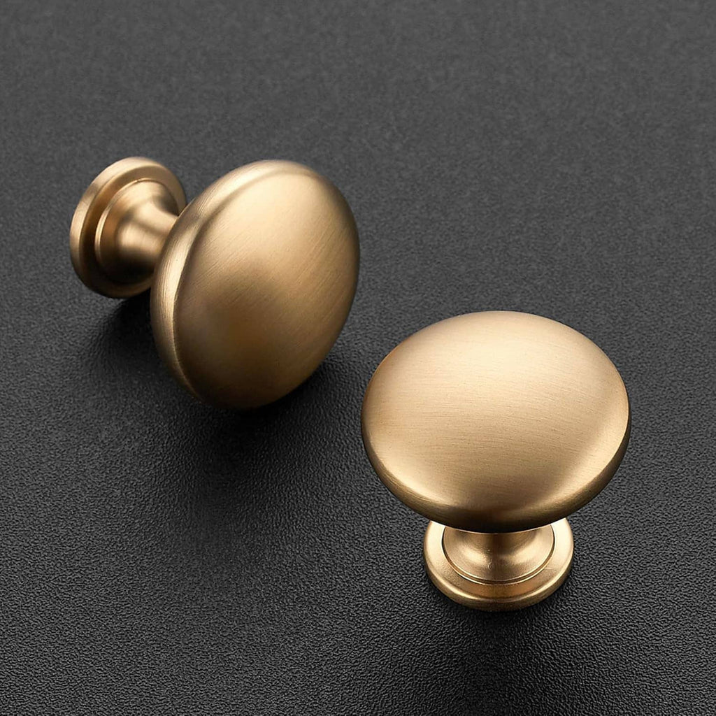Set of champagne bronze round cabinet knobs with flared pedestal bases