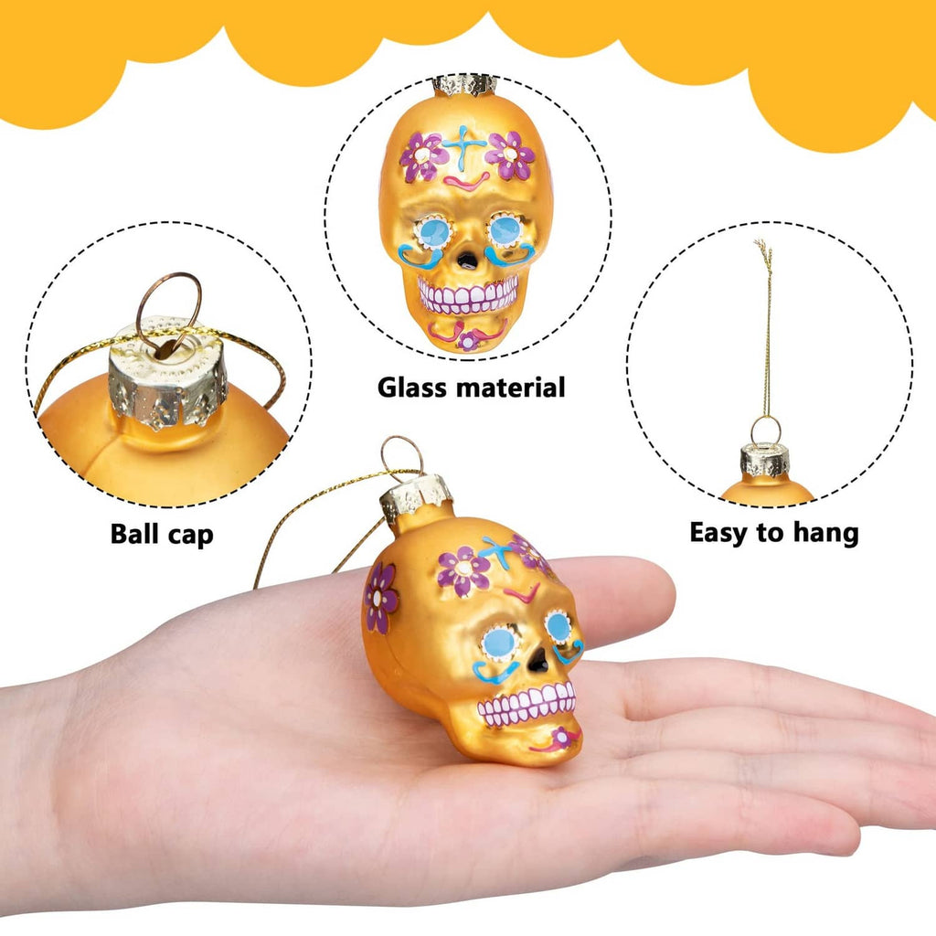 Orange Day of the Dead glass skull ornament with glossy finish and hanging loop
