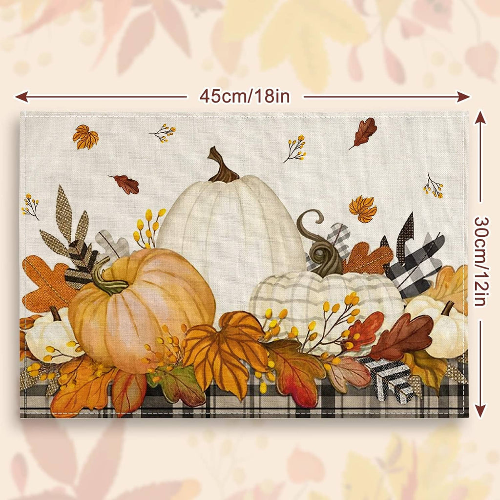 Beige placemat with large pumpkin centerpiece and autumn leaf border design
