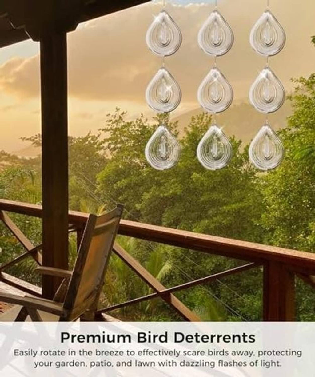 Silver reflective teardrop bird scare discs hanging in rows from loop cords