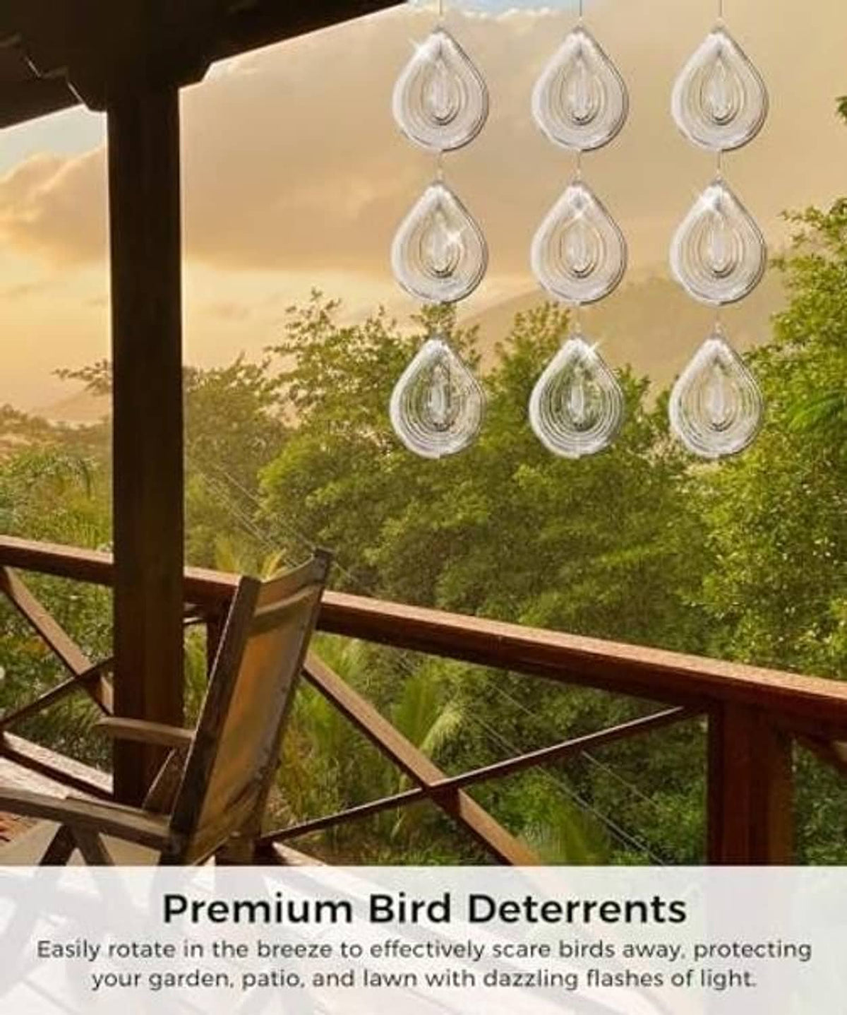 Silver reflective teardrop bird scare discs hanging in rows from loop cords