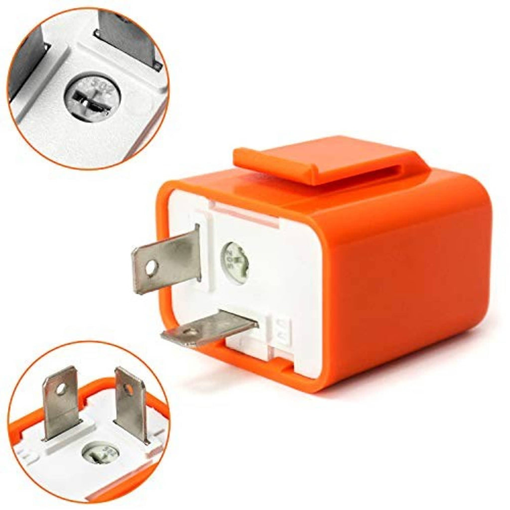 Orange 2-pin flasher relay with metal clips; close-up of mounting screw area