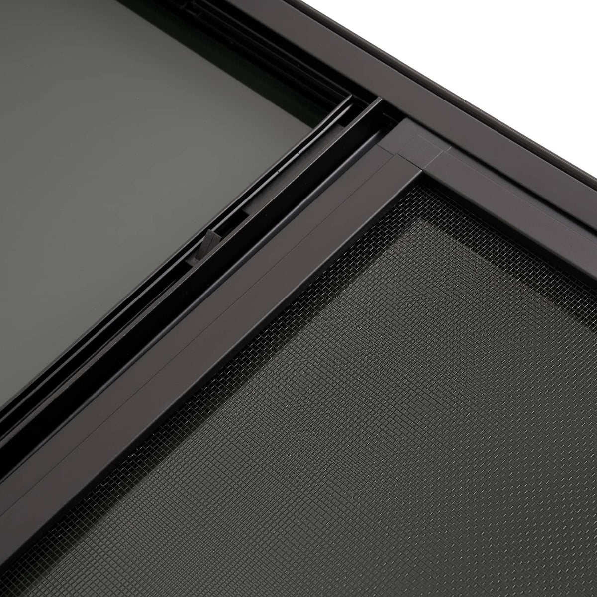 RV window track and mesh screen close-up inside black frame.