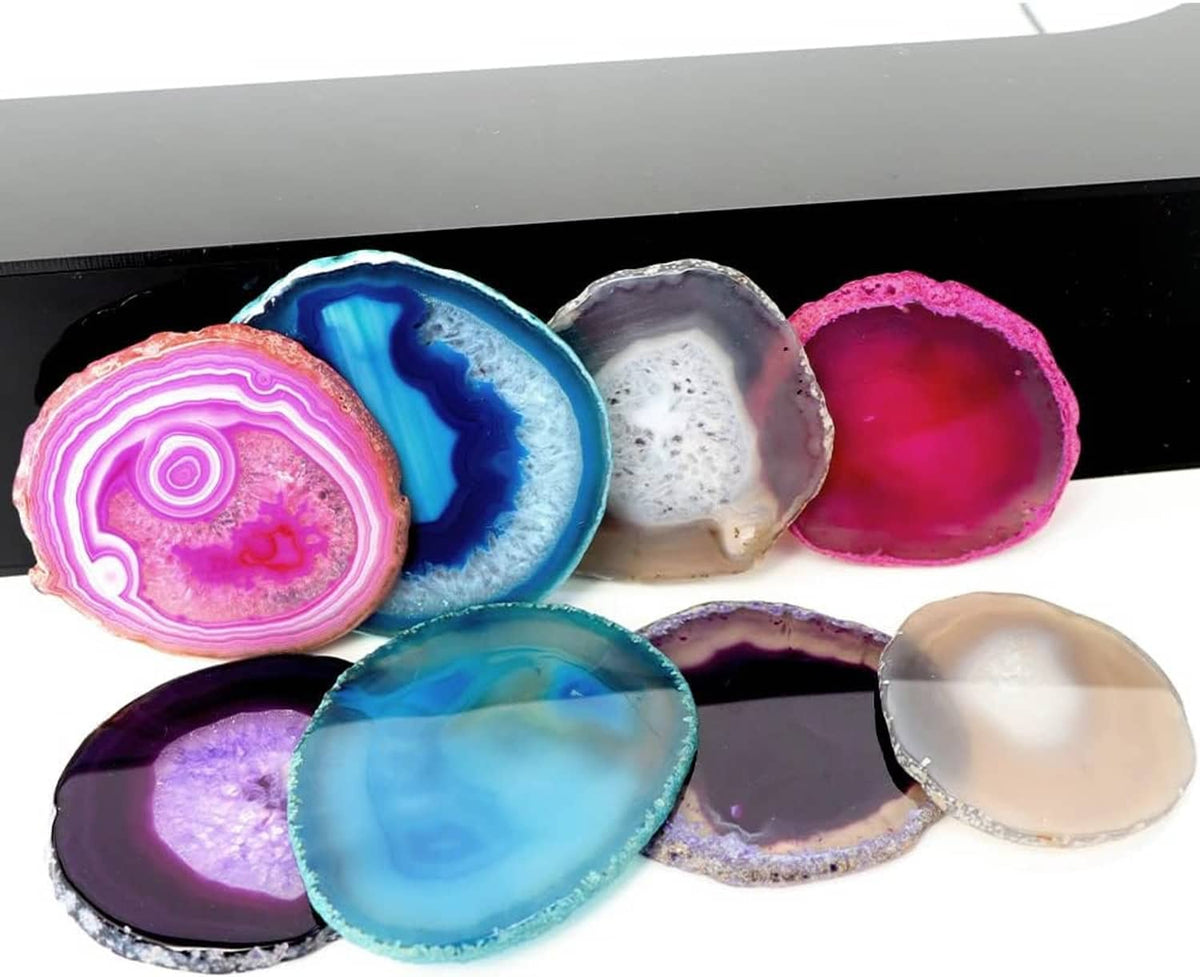 Set of teal and purple agate geode coasters with geode rings and crystal-like centers