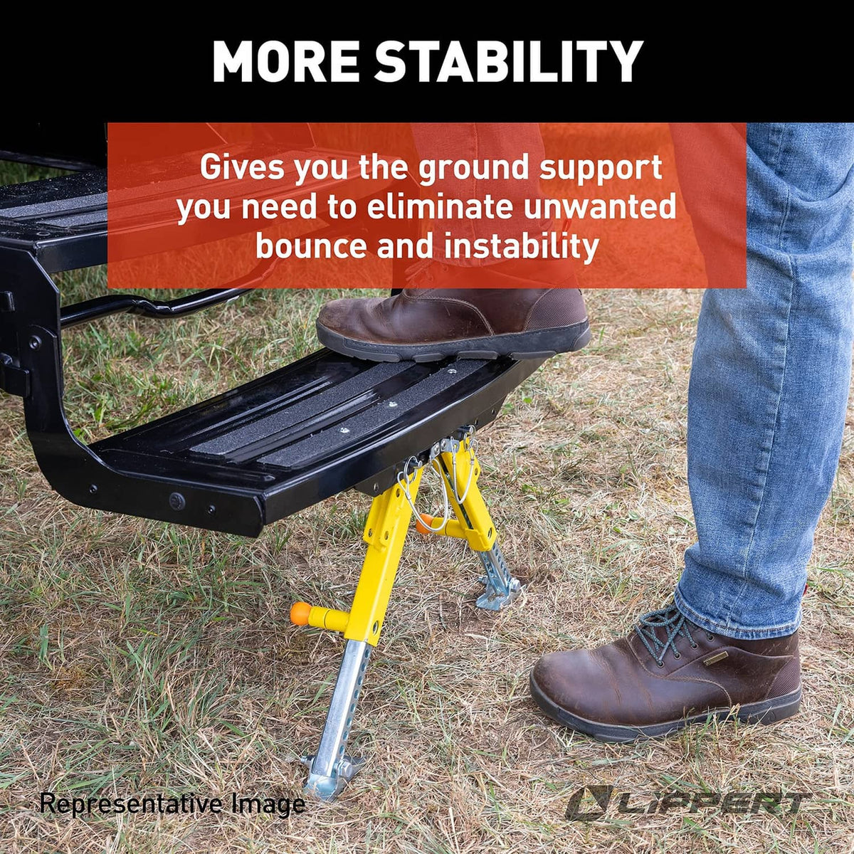 RV step stabilizer under black step with yellow legs outdoors