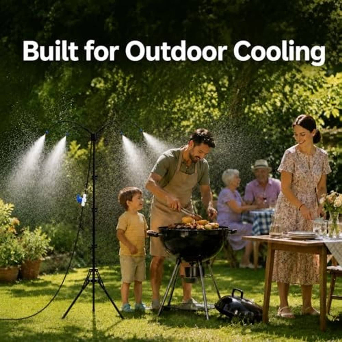 Outdoor misting tripod spraying fine mist near an outdoor barbecue setup