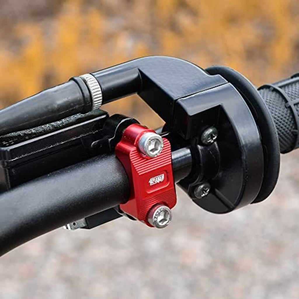 Red CNC brake lever holder clamp mounted on a motorcycle handlebar with hardware