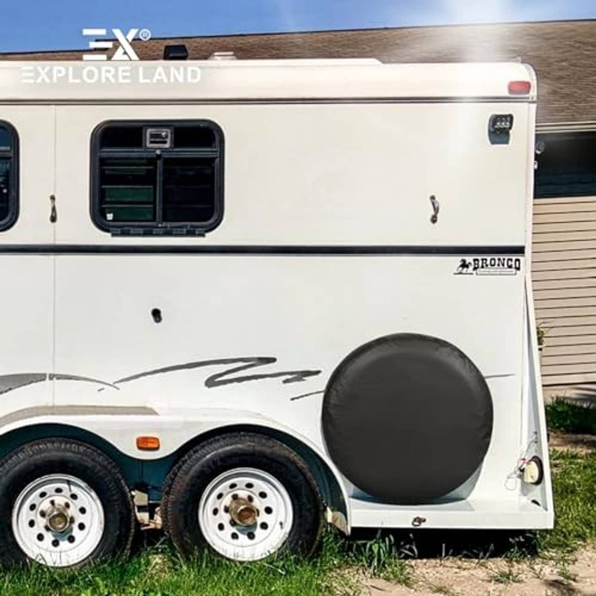 Black round spare tire cover on camper trailer spare wheel