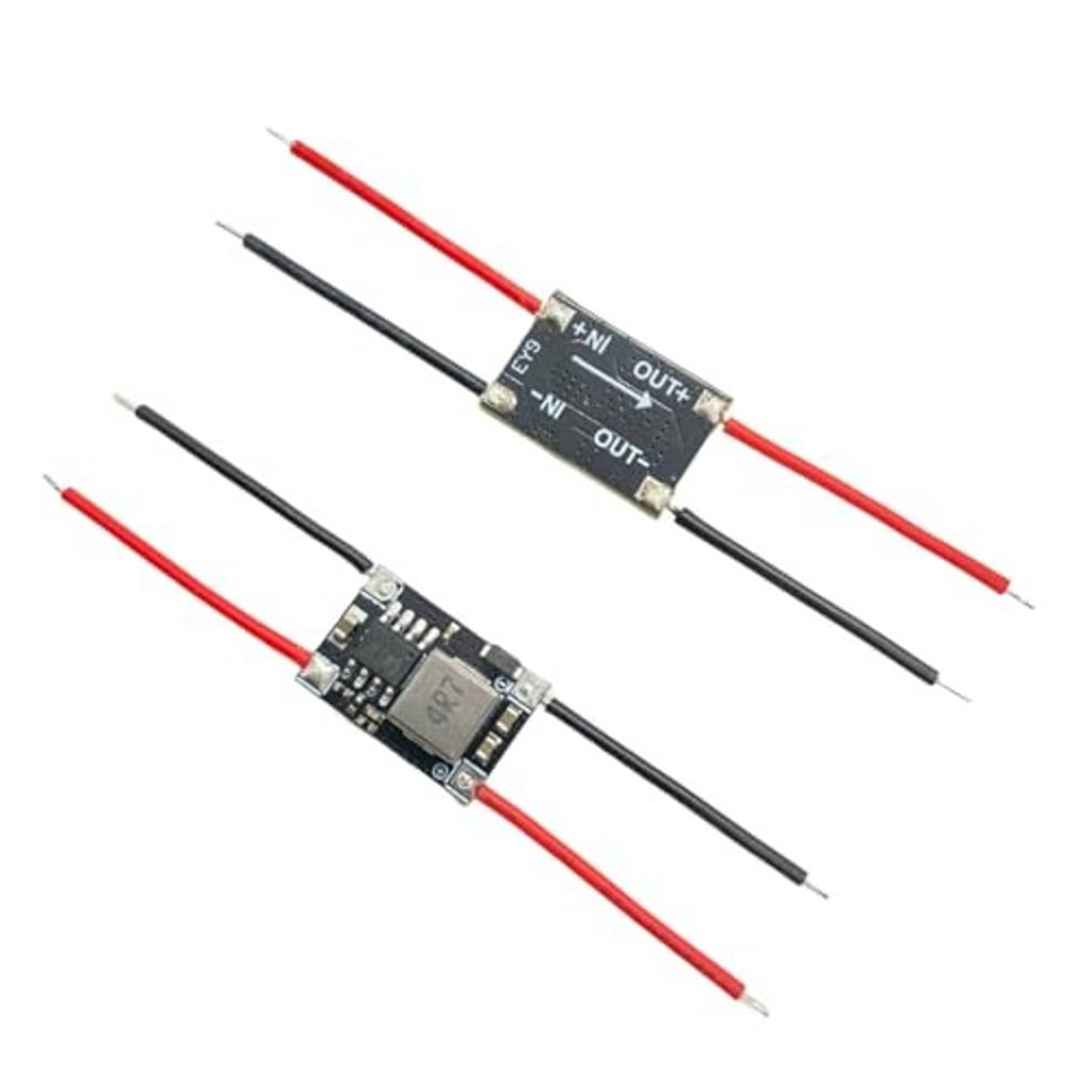 3.3V buck converter module with +IN OUT markings, red/black leads on black PCB