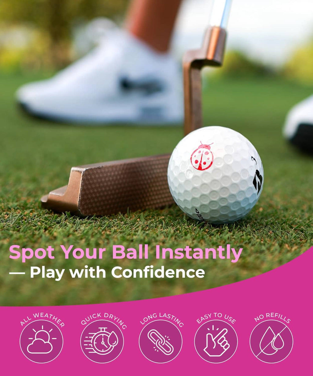 White golf ball with a red cherry icon near a golf club on the grass