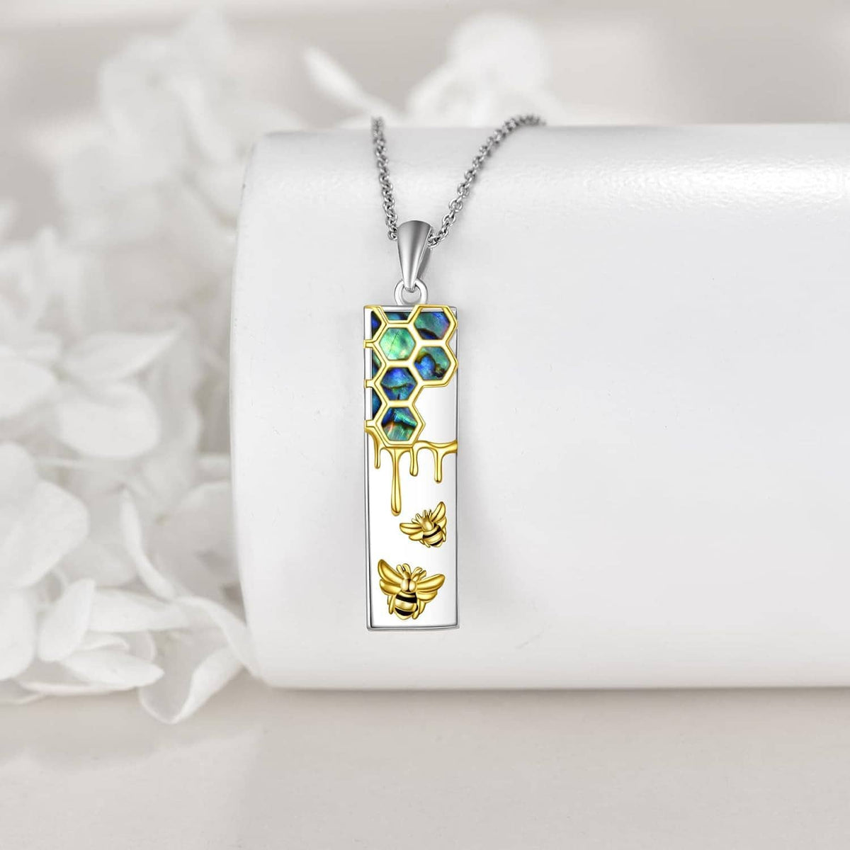 Sterling silver rectangle pendant necklace with blue hexagon enamel and gold bee accents