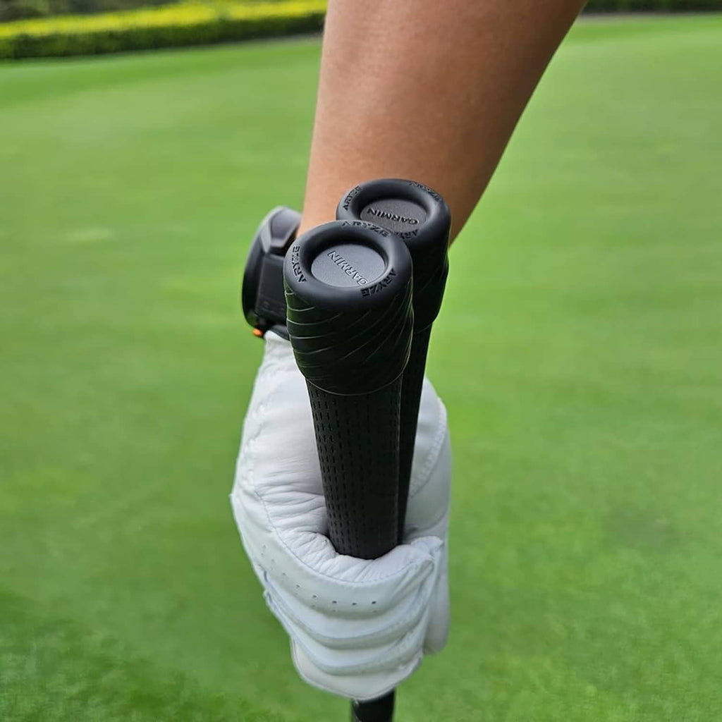 Black sensor covers on golf glove, two molded caps with logo on top