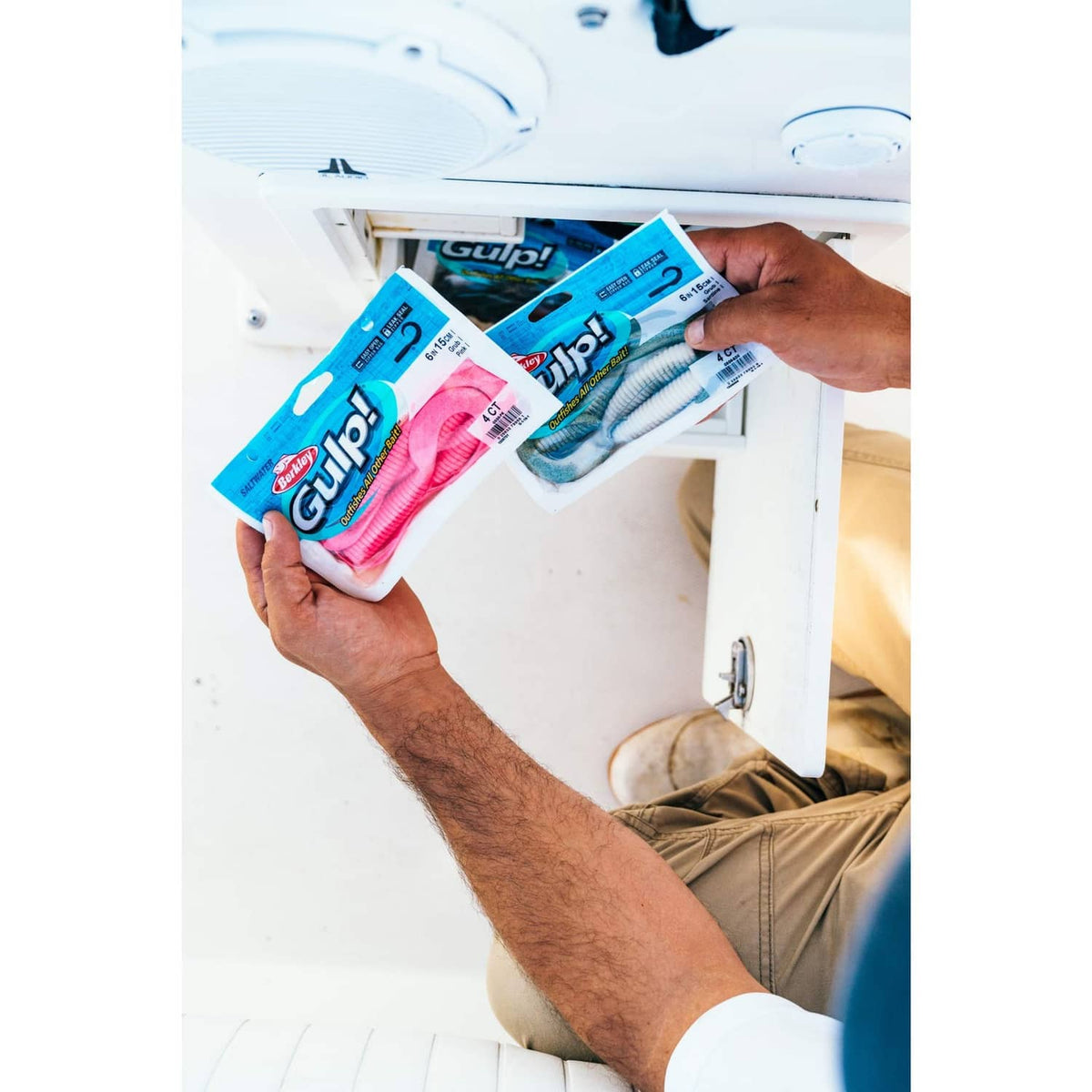 Berkley Gulp! soft bait packs held in hands