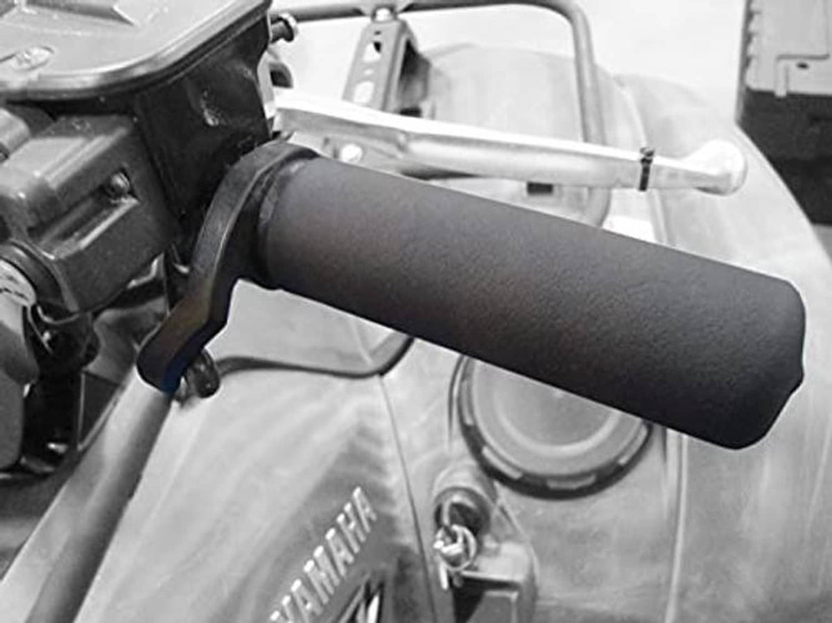 Black rubber hand throttle grip mounted on handlebar near controls