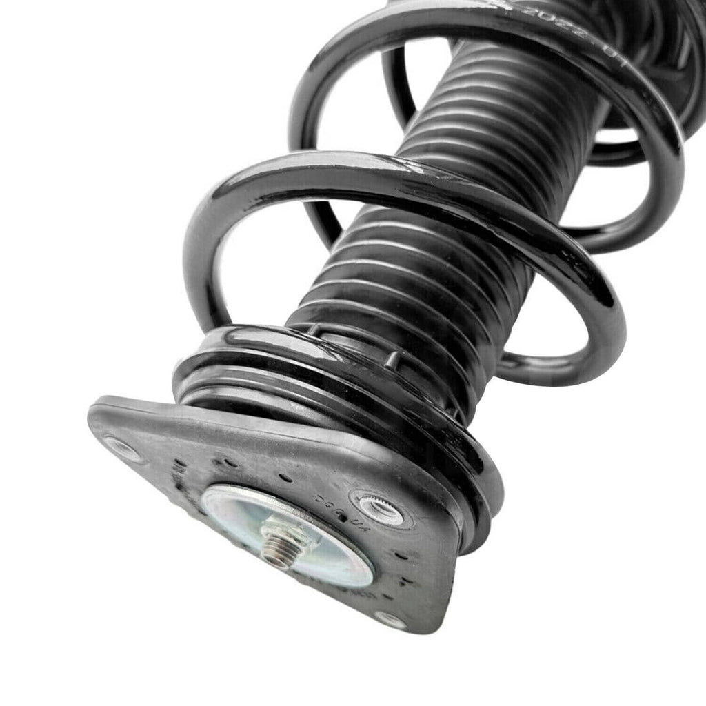 Coiled shock strut spring with mounting plate and rubber seal