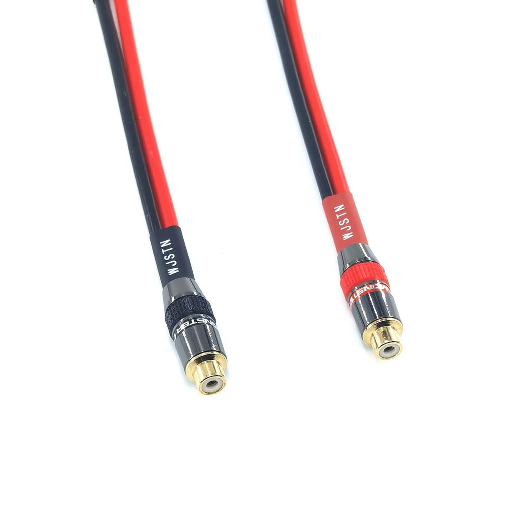 Close-up of gold banana plug ends on a red and black speaker audio cable