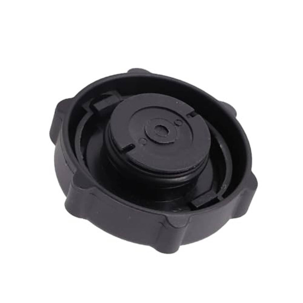 Black plastic gas oil filler cap underside with central molded plug and tabs
