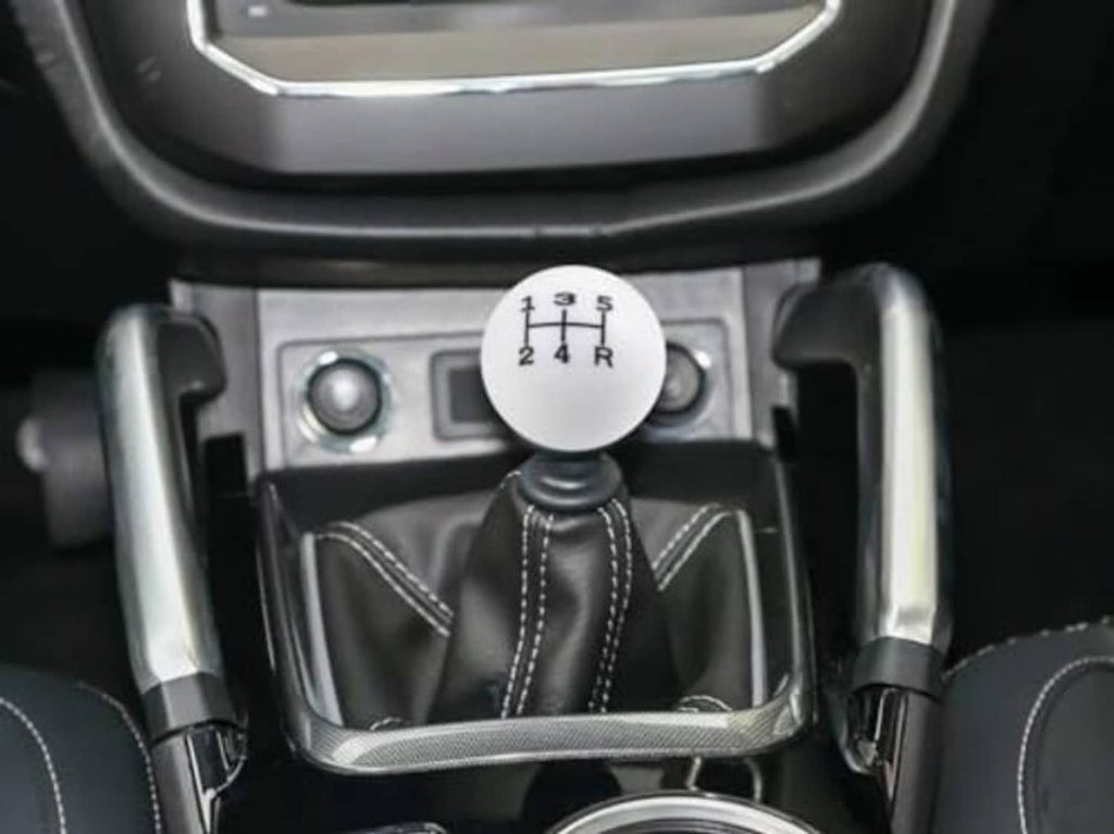 White round 5-speed shift knob with black 1-5 and R numeral grid