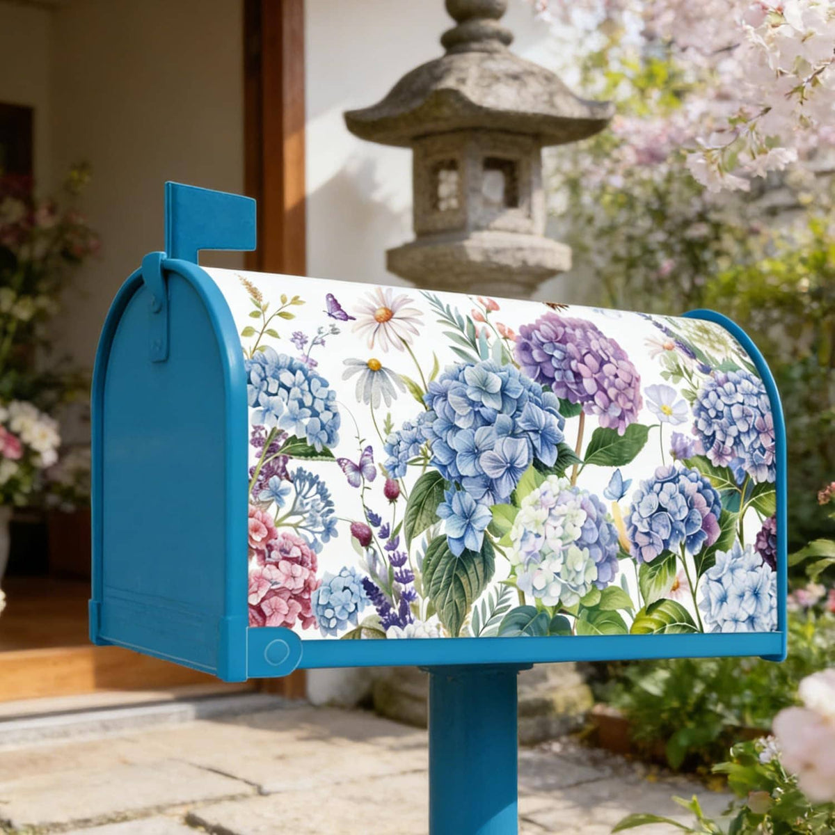 Floral hydrangea mailbox cover with blue hinged door on outdoor post
