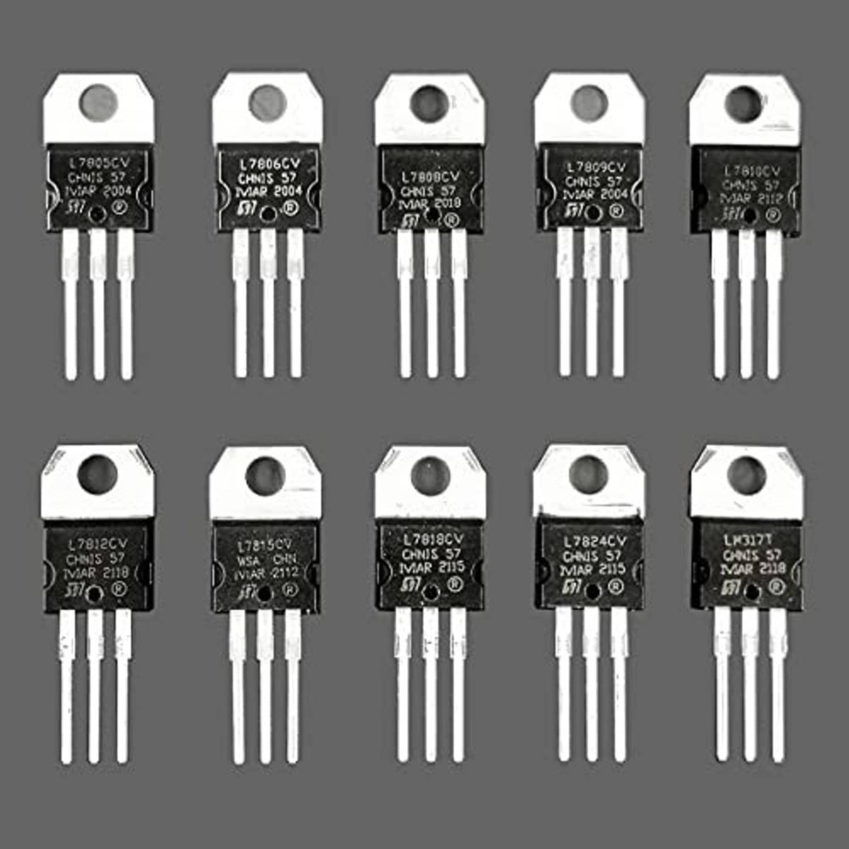 Set of 10 black voltage regulator ICs with metal tabs and three-pin leads