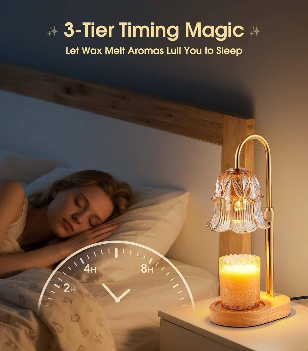 Electric candle warmer lamp with amber glass bell shade and glowing candle on nightstand