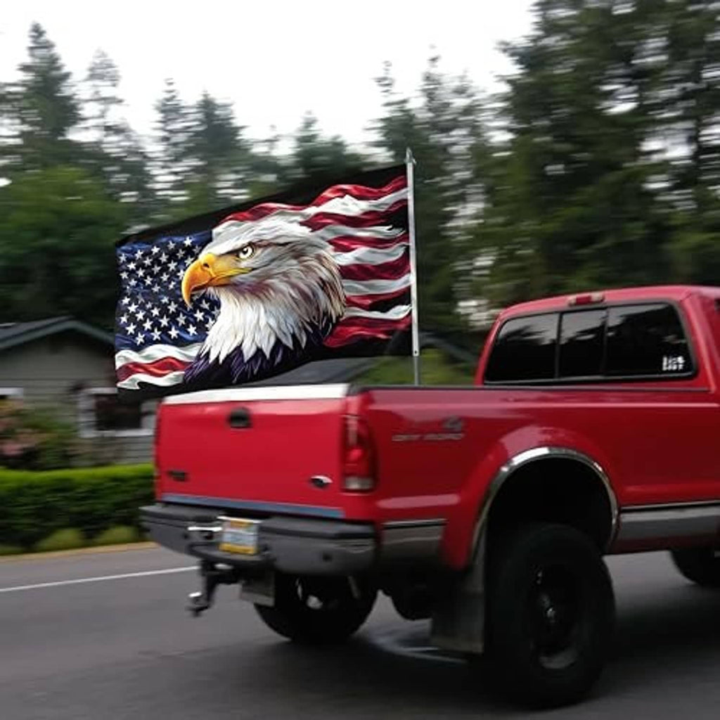 Eagle patriotic flag on a roadside pole with stars and stripes eagle design