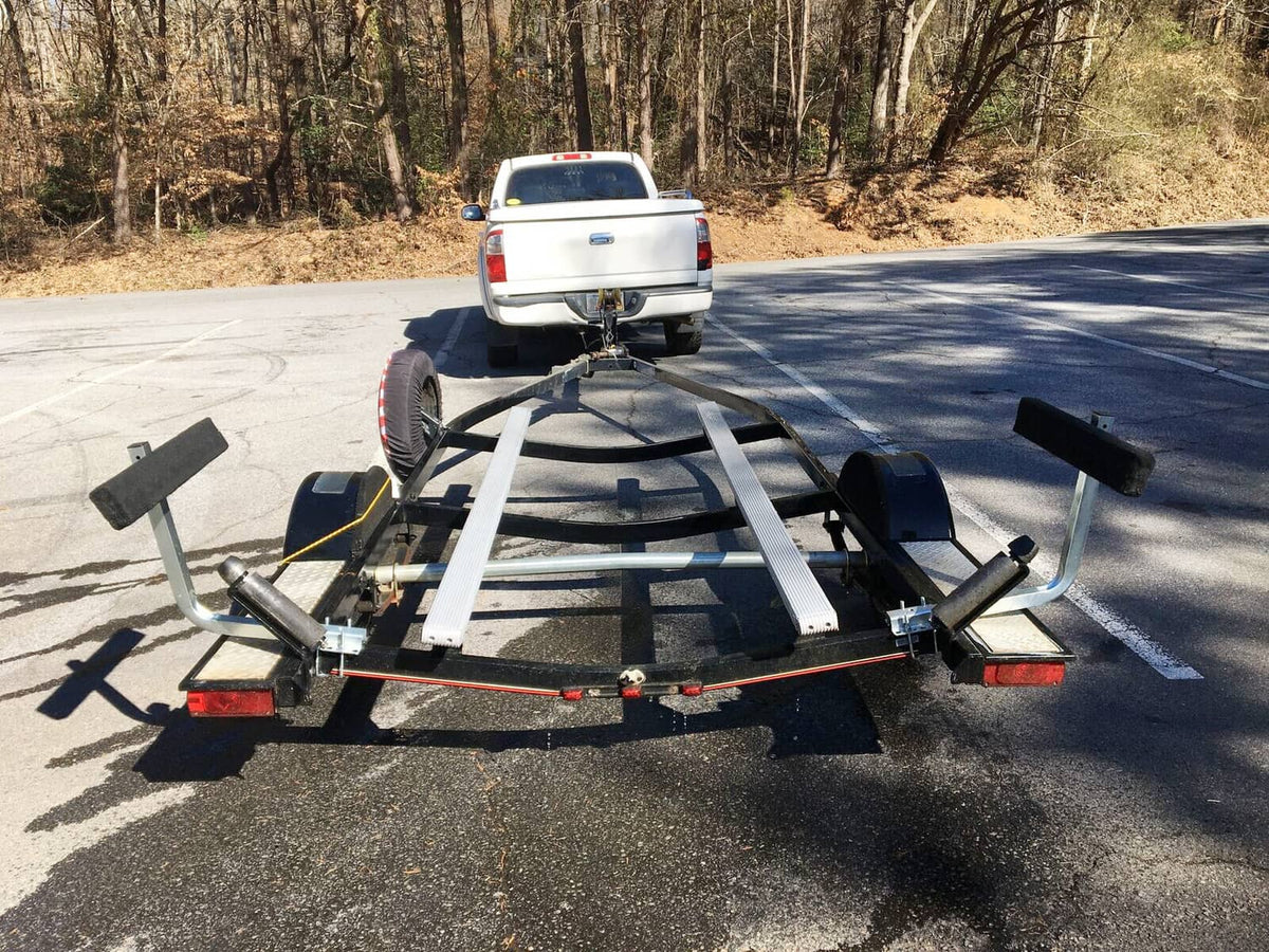 Boat trailer rear support bunk guide bars and carpeted bunks for loading