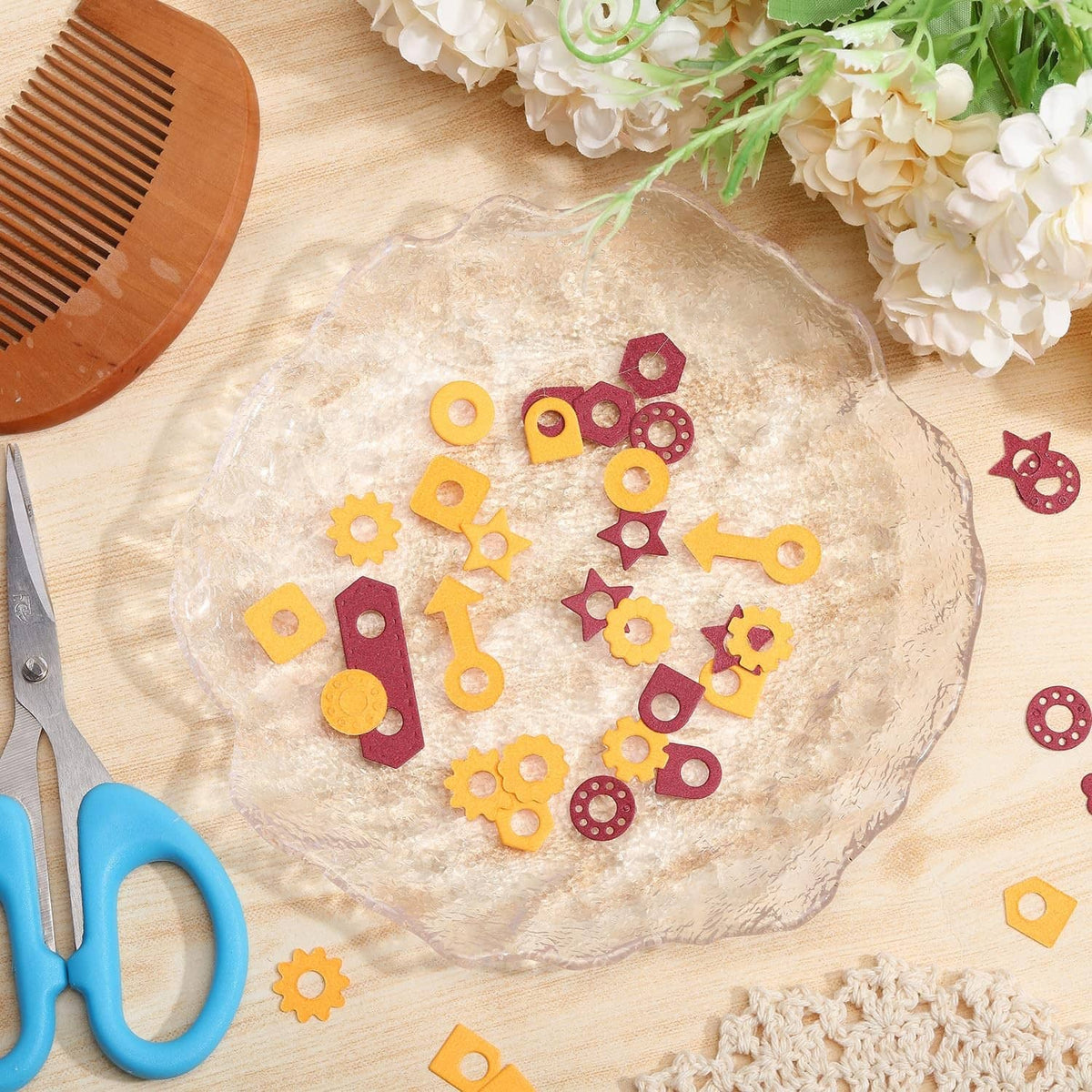 Assorted page tab hole reinforcement cutting dies, including gears and star shapes