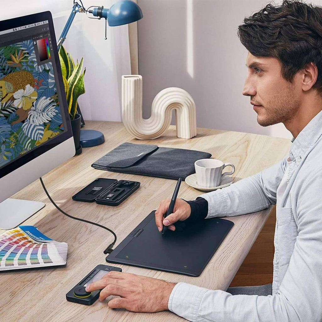 Micro USB cable connected between tablet and computer for drawing and pen input.