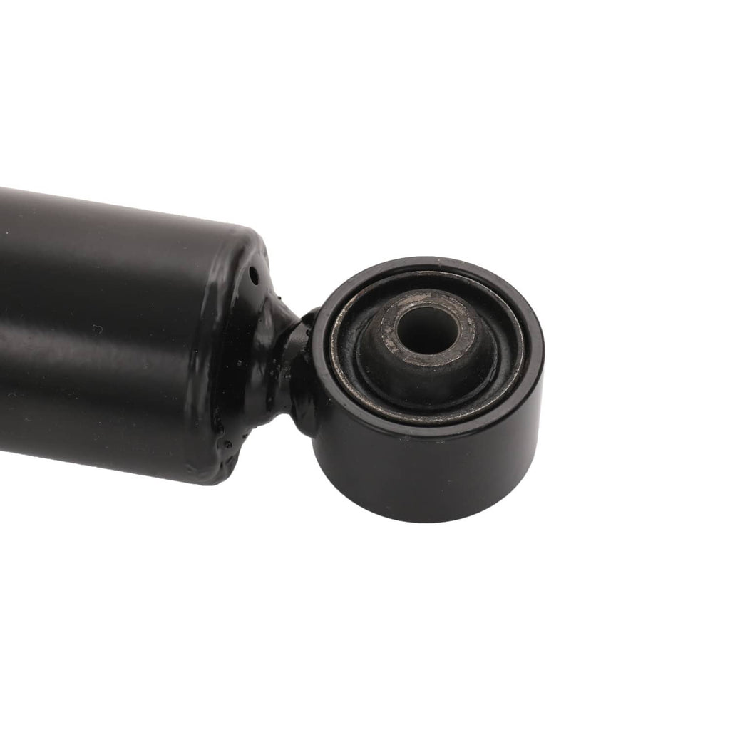 Close-up of black coilover bushing joint on a shock absorber shaft