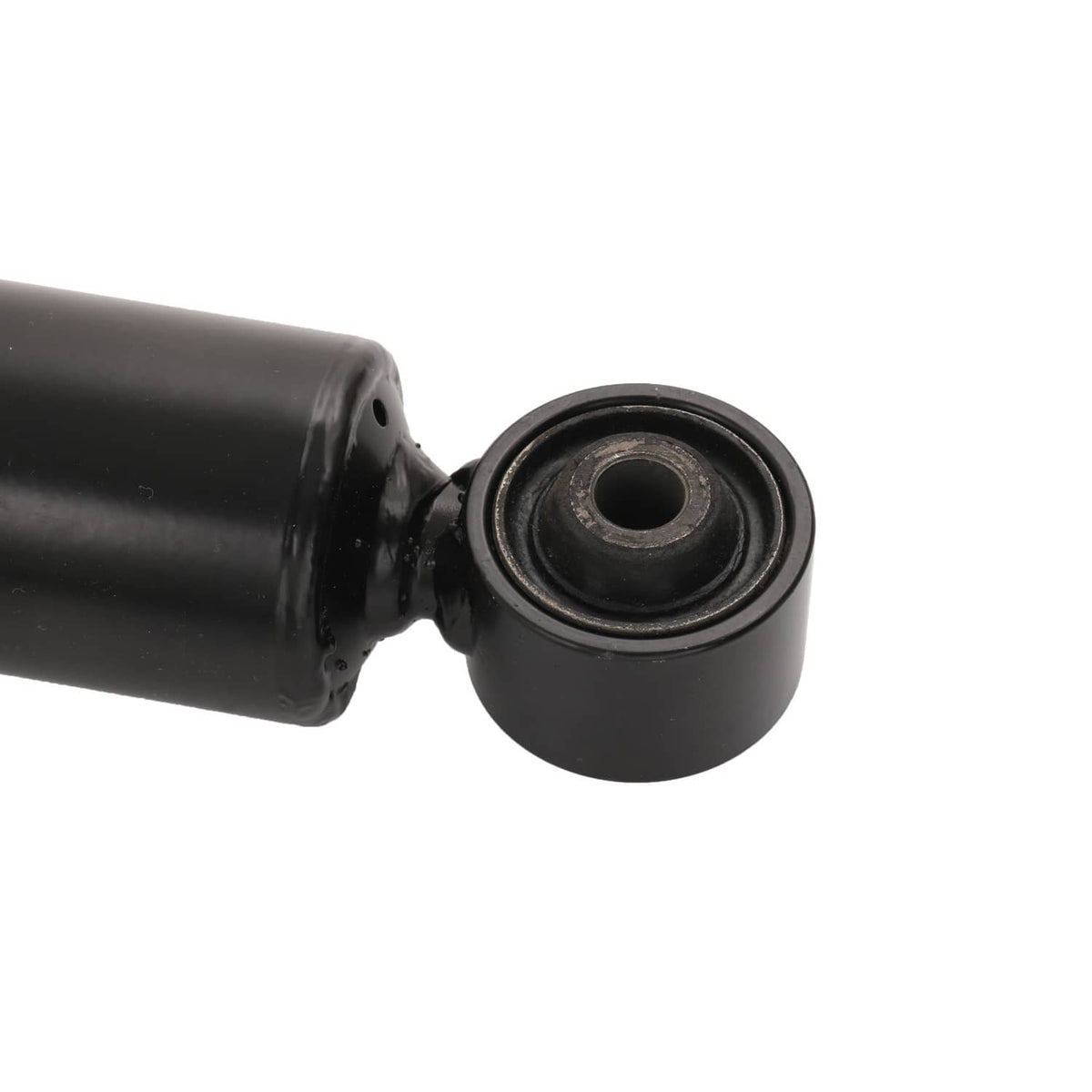 Close-up of black coilover bushing joint on a shock absorber shaft