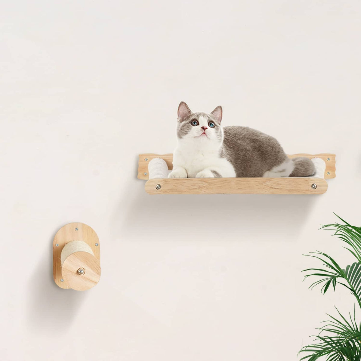 Wall-mounted cat hammock shelf with a light wood frame and cushioned perch