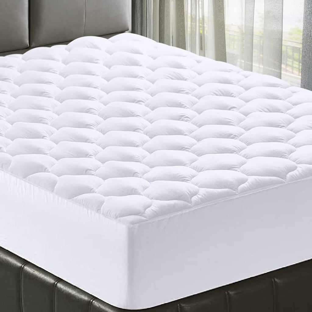White king mattress pad topper with cloud-bubble quilted design, fully covering the bed