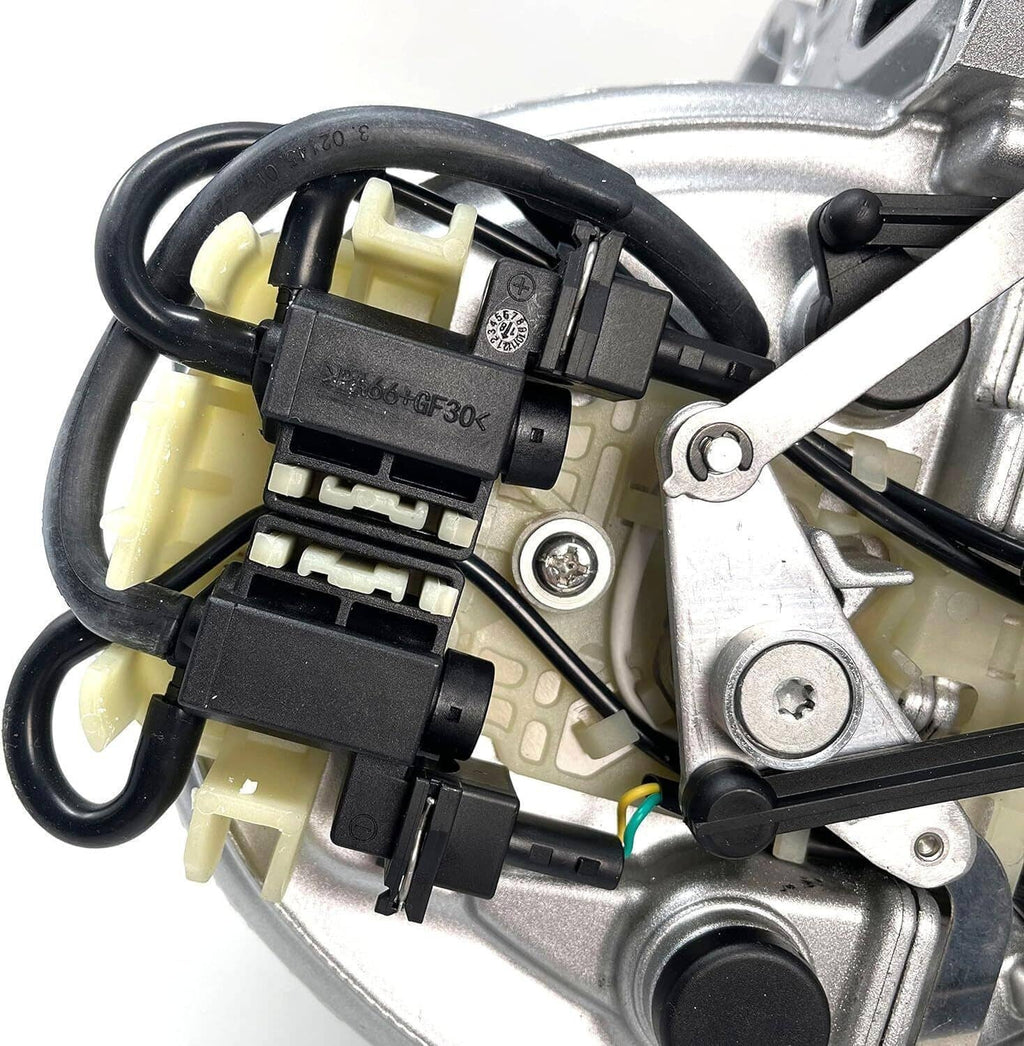 Close-up of intake manifold electrical connectors on silver housing