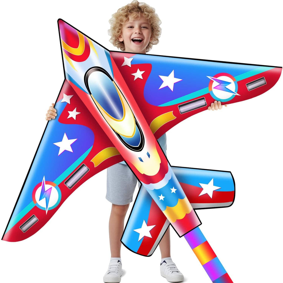 Children's airplane kite held by a smiling kid, red and blue stars and rocket design