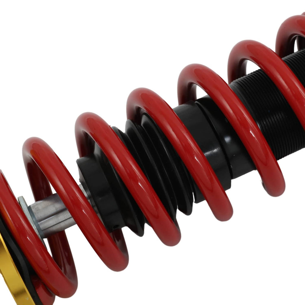 Coilover suspension strut with red coil spring and black shock body