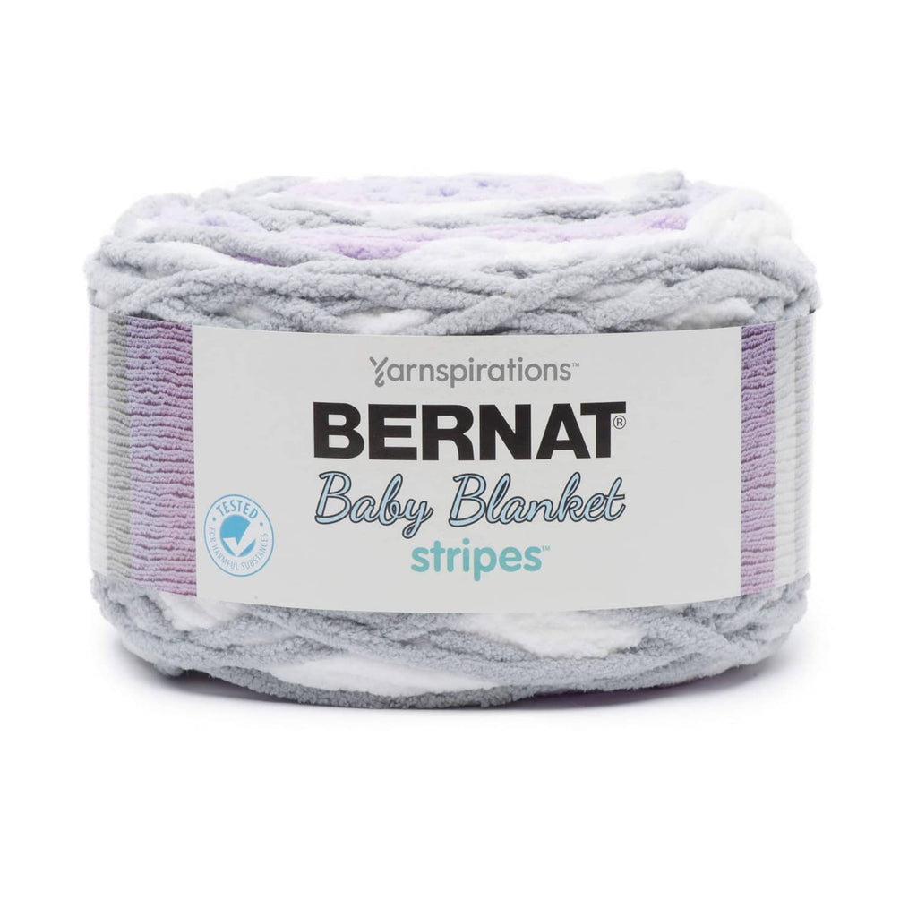 Self-striping baby blanket yarn skein, gray, white, and purple stripes