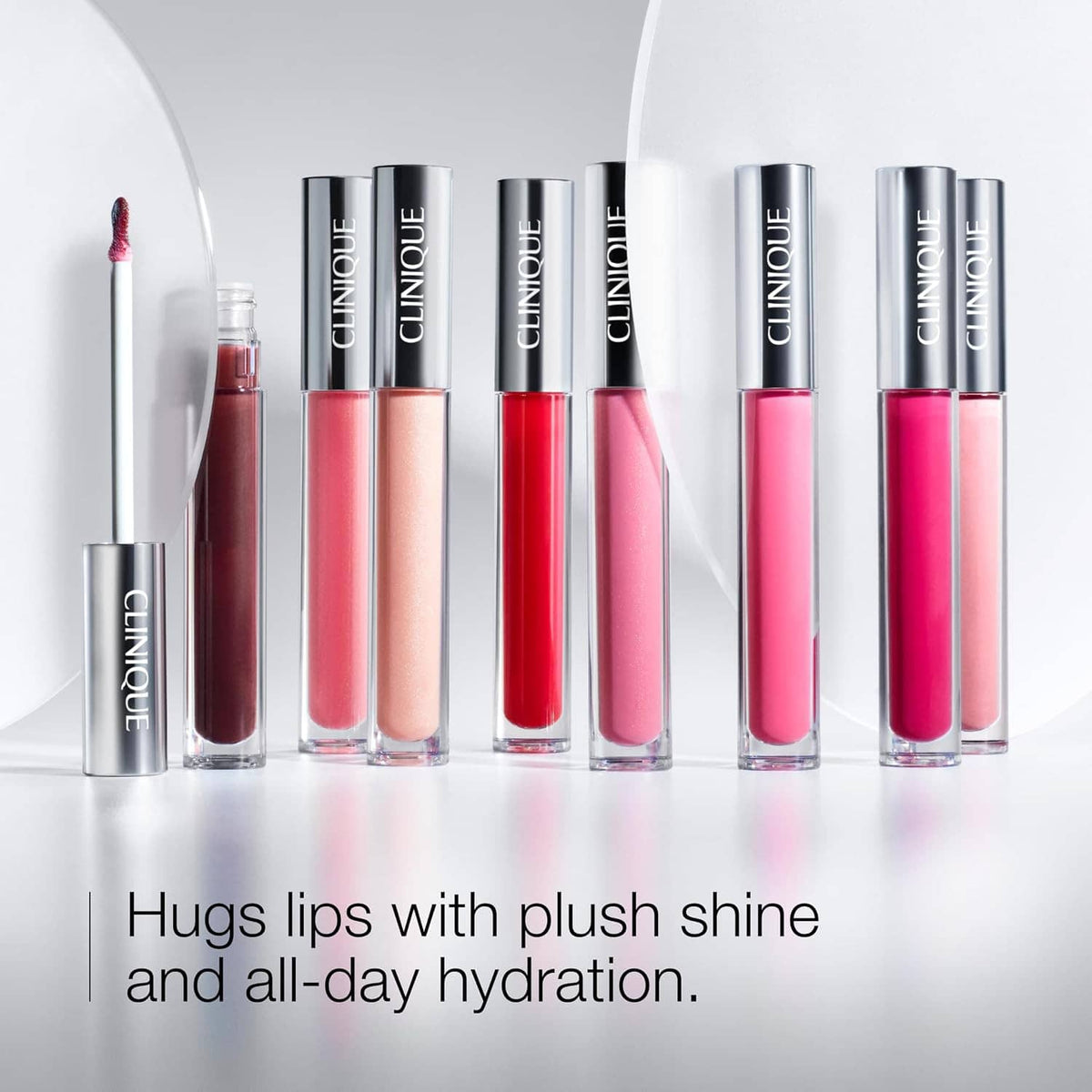 Set of Clinique Pop Plush lip gloss tubes in assorted shades with applicator wands