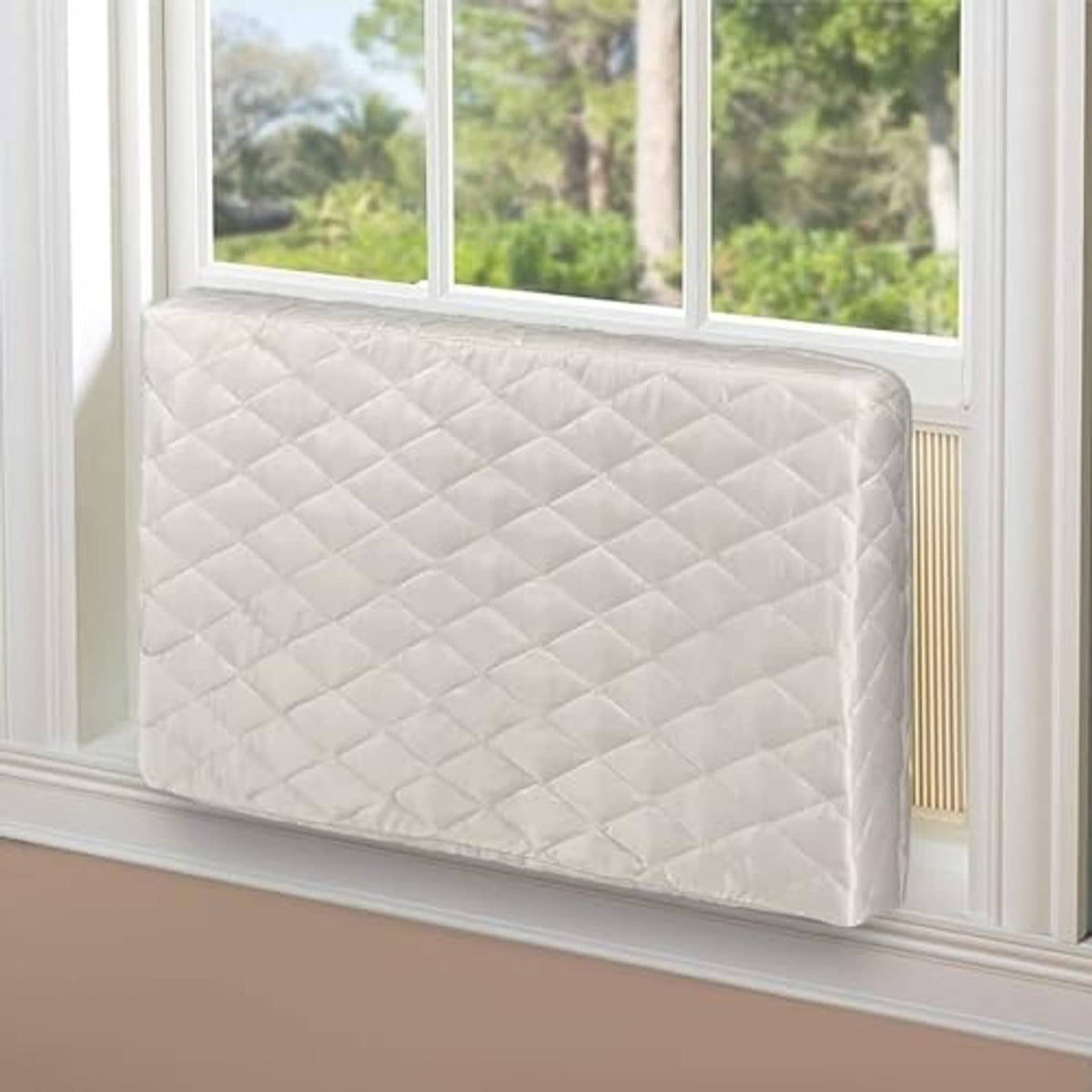 Cream quilted air conditioner cover on window unit, full front