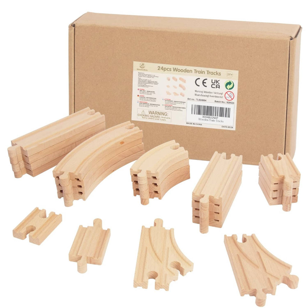 Cardboard box with light wood train track pieces, including straight and curved rails.