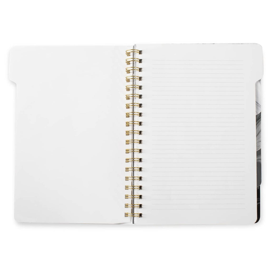 Large tab notebook opened to lined pages, gold spiral binding visible