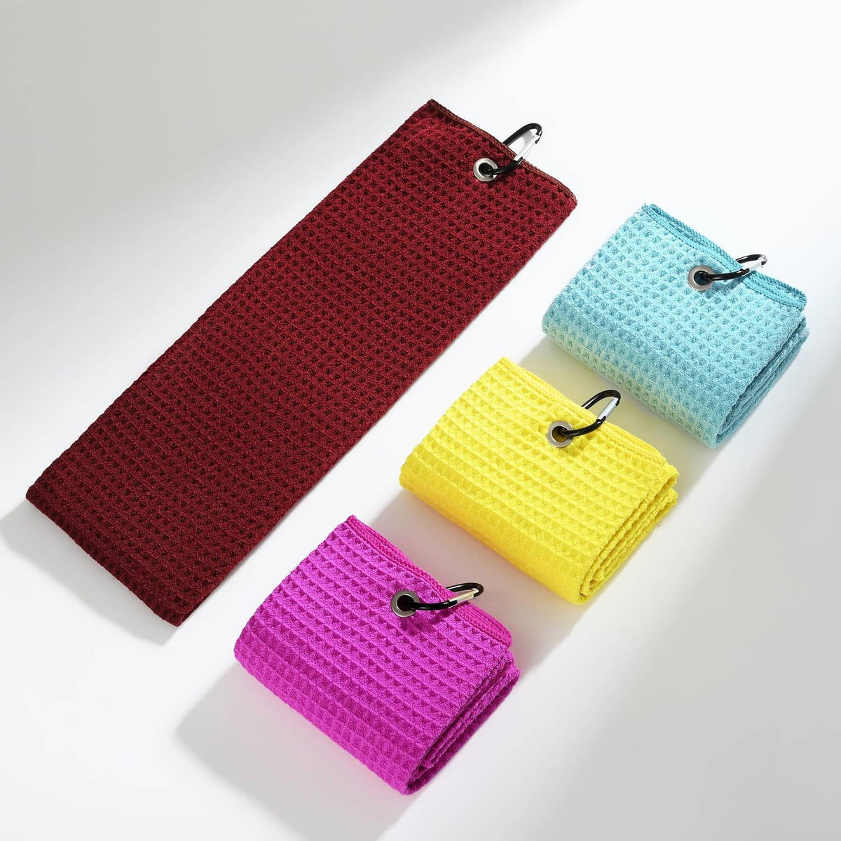 Set of waffle-weave microfiber towels with carabiner clips, including magenta