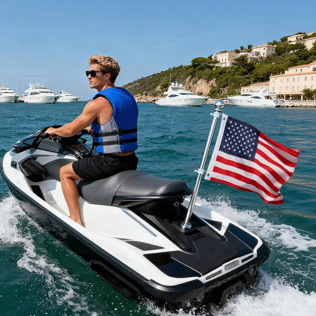 American boat flag on a mounted pole near the bow of a speedboat on the water