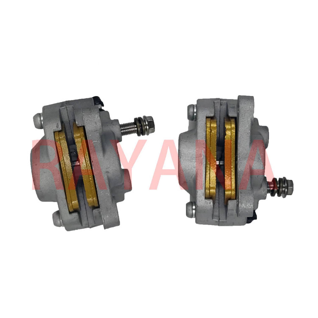 Front brake caliper with exposed brake pads, gray housing, gold friction material