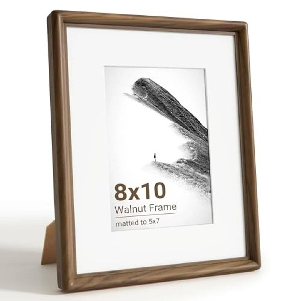Walnut wood 8x10 picture frame with white mat and glass front view on a folding stand