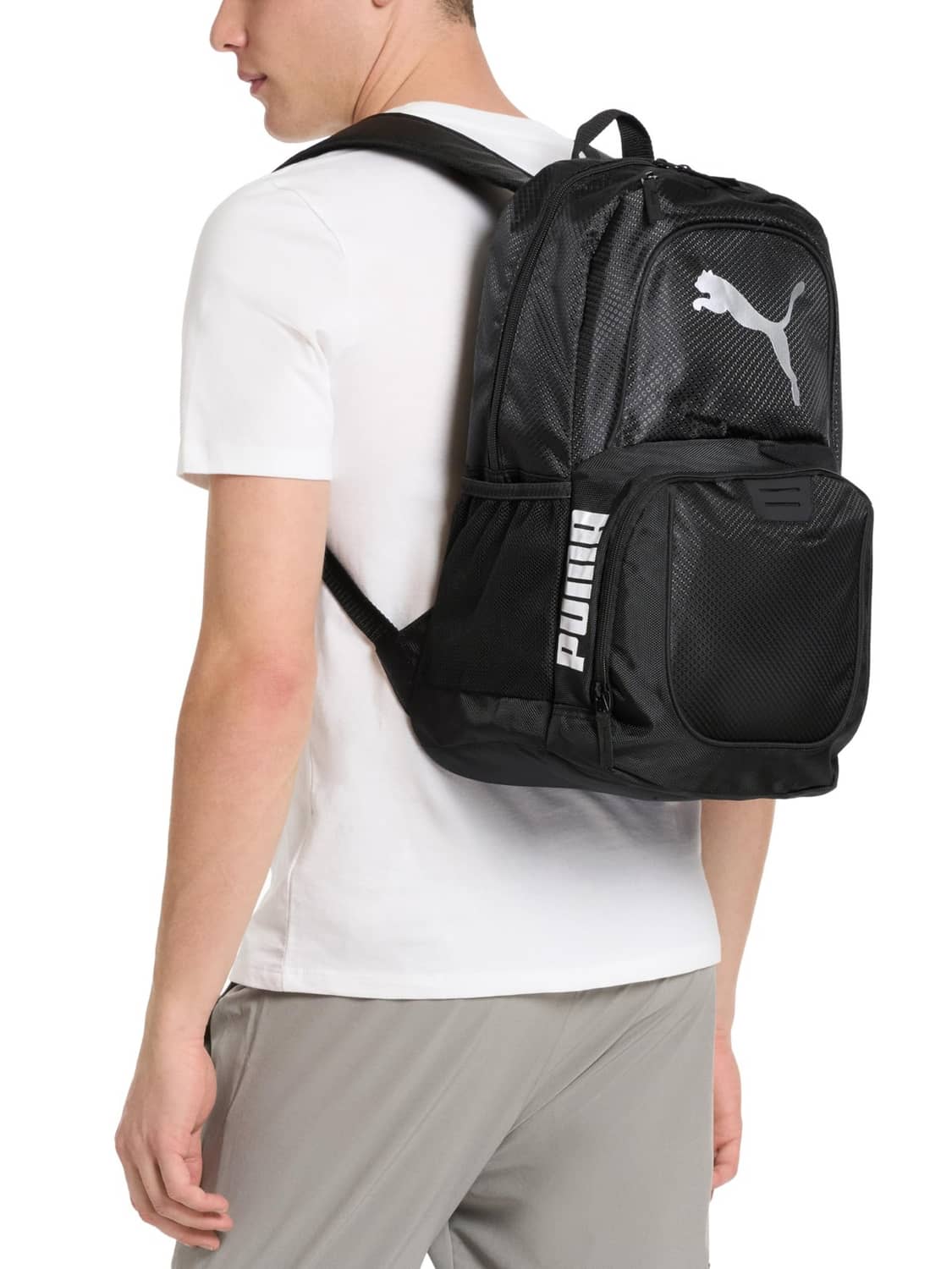 Puma Contender backpack worn, black with rose Puma logo on front mesh pocket