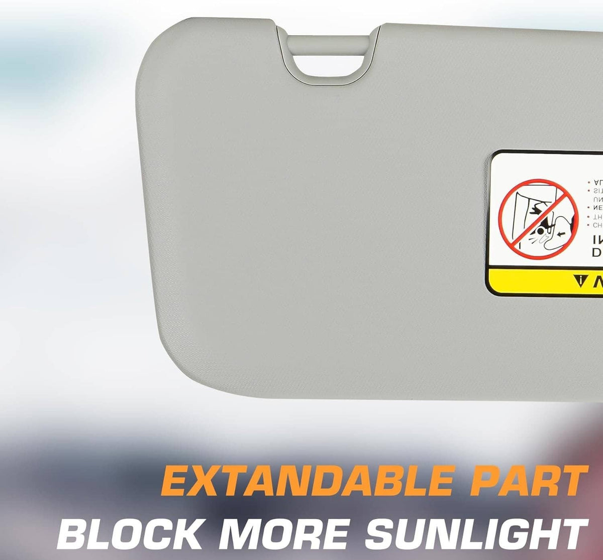 Gray sun visor with mirror area, warning label on visor panel